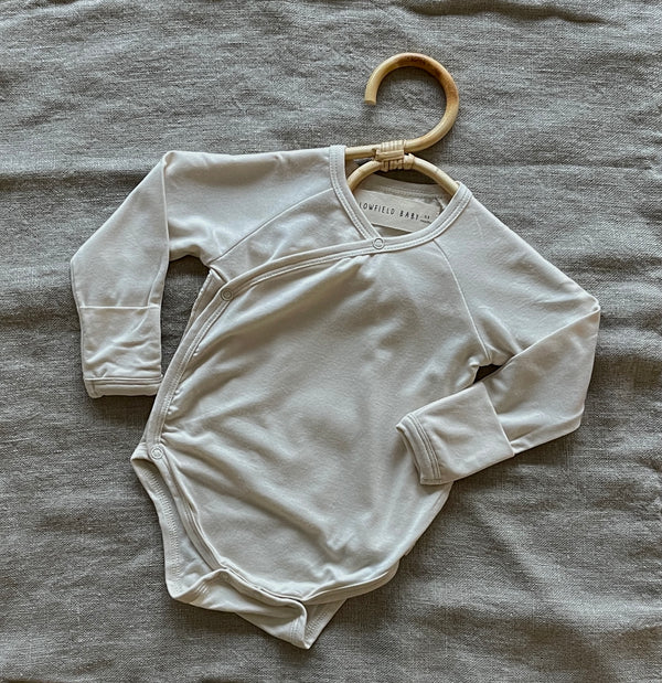 baby bodysuit in cream